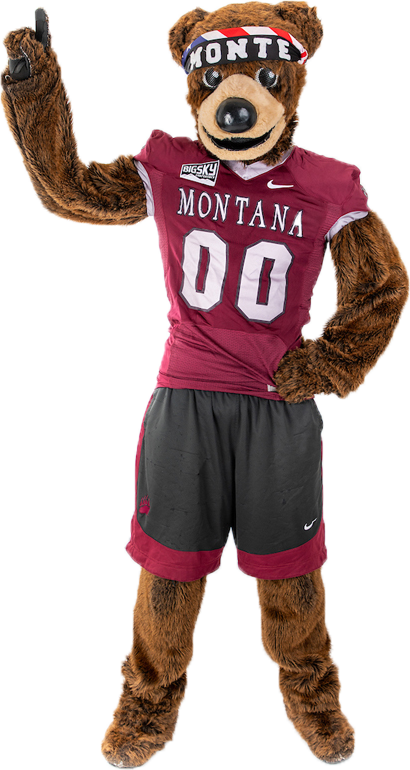 Monte the mascot stands while pointing up with his right hand raised